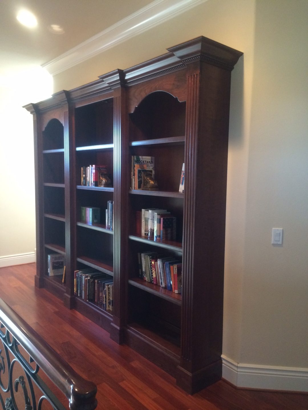 Elaborate custom cherry book shelf All Things Interior
